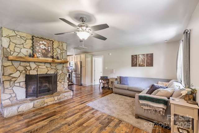 3980 English Oak Dr, Lincolnton, NC 28092 - living area featuring wood finished floors, a ceiling fan, and a fireplace