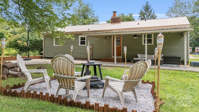 3980 English Oak Dr, Lincolnton, NC 28092 - back of property with a ceiling fan, a patio area, a chimney, a metal roof, and a yard