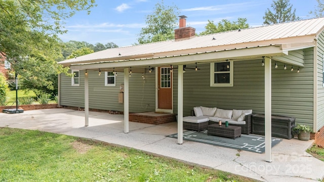 3980 English Oak Dr, Lincolnton, NC 28092 - back of house featuring a patio area, an outdoor living space, a chimney, and a metal roof