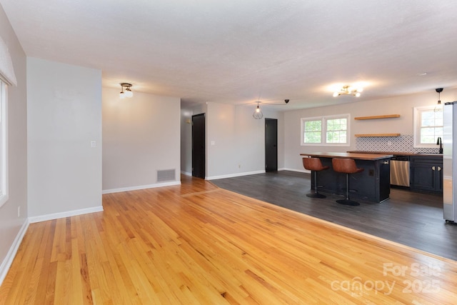 46 Dixon Ter Unit 12, Candler, NC 28715 - unfurnished living room with wood finished floors and baseboards