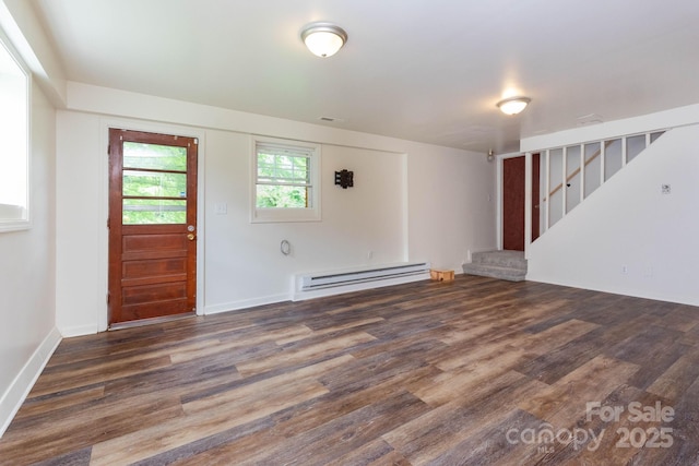 46 Dixon Ter Unit 12, Candler, NC 28715 - unfurnished living room with a baseboard heating unit, stairway, and wood finished floors