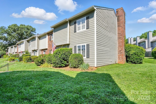 6044 Heath Valley Rd, Charlotte, NC 28210 - rear view of house with a yard and a chimney