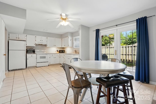 6044 Heath Valley Rd, Charlotte, NC 28210 - dining space featuring a ceiling fan, light tile patterned floors, and baseboards