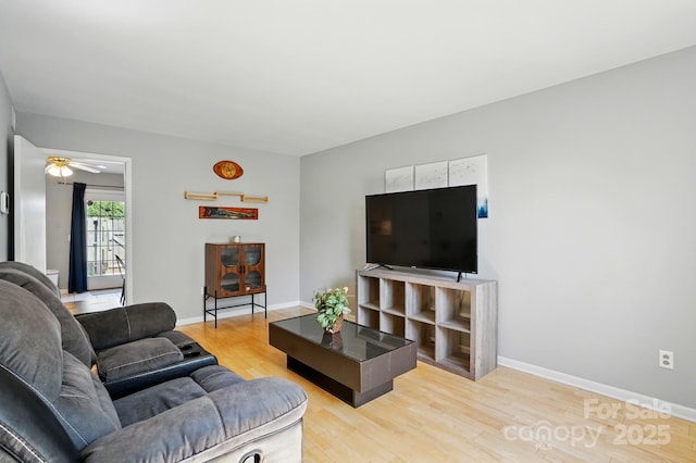 6044 Heath Valley Rd, Charlotte, NC 28210 - living room with light wood-style floors, baseboards, and a ceiling fan