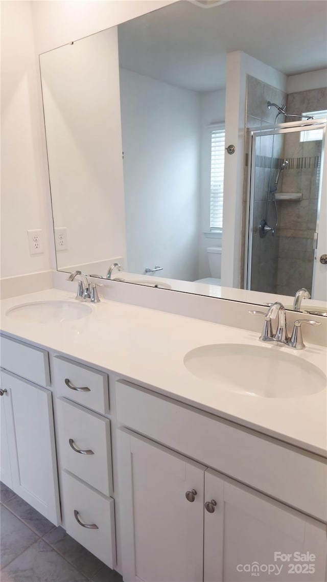 5775 Soft Shell Dr Unit 310, Lancaster, SC 29720 - full bathroom featuring double vanity, toilet, a stall shower, and tile patterned floors