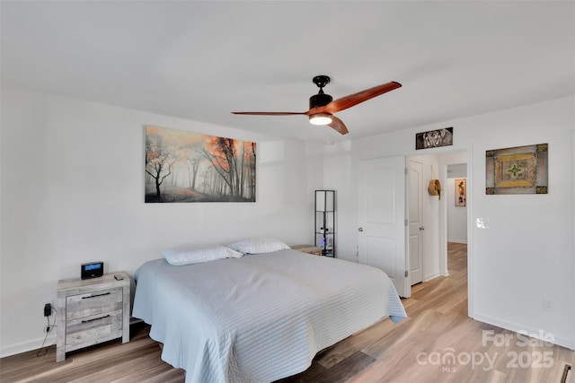 112 Aspire Cir, Wingate, NC 28174 - bedroom featuring light wood finished floors and a ceiling fan