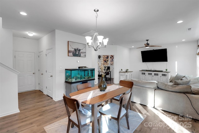 112 Aspire Cir, Wingate, NC 28174 - dining space featuring a ceiling fan, light wood finished floors, a chandelier, and recessed lighting