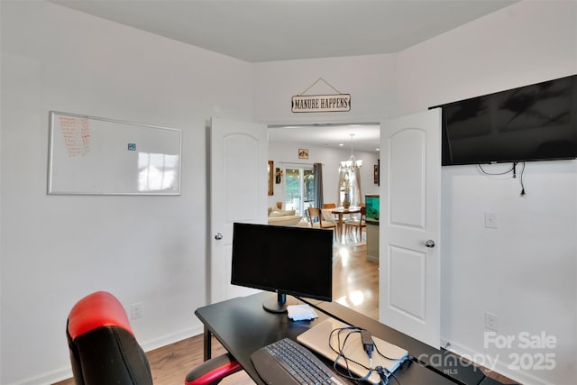 112 Aspire Cir, Wingate, NC 28174 - home office with wood finished floors and a chandelier
