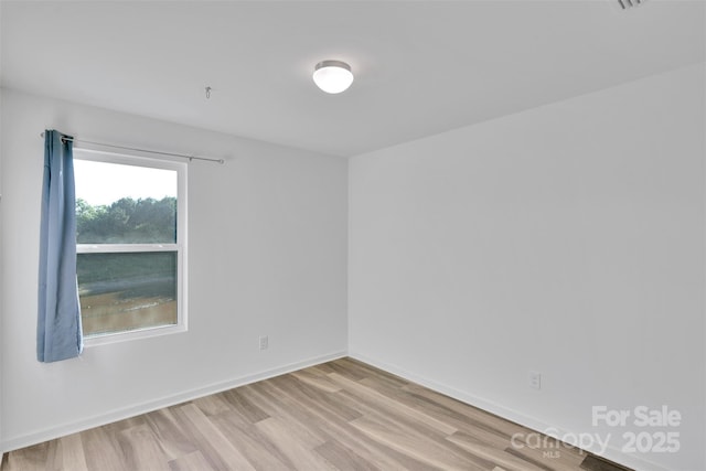 112 Aspire Cir, Wingate, NC 28174 - empty room featuring wood finished floors and baseboards