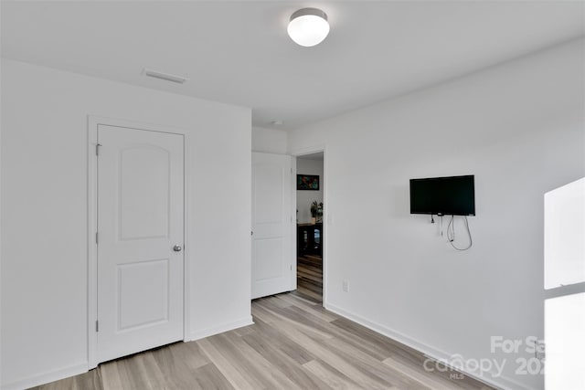 112 Aspire Cir, Wingate, NC 28174 - unfurnished bedroom with light wood finished floors and baseboards
