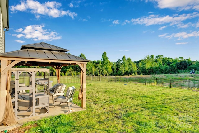 112 Aspire Cir, Wingate, NC 28174 - fenced backyard with a gazebo and a patio