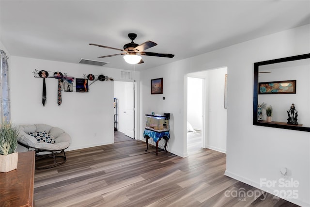 112 Aspire Cir, Wingate, NC 28174 - living area with wood finished floors and ceiling fan