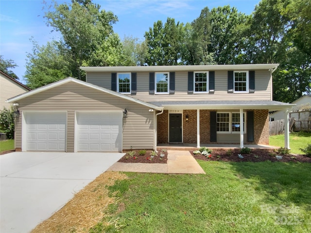 7134 Rollingridge Dr, Charlotte, NC 28211 - view of front of house featuring an attached garage, concrete driveway, a porch, and brick siding
