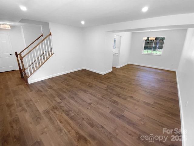 7134 Rollingridge Dr, Charlotte, NC 28211 - spare room featuring stairway, dark wood-style floors, baseboards, and recessed lighting