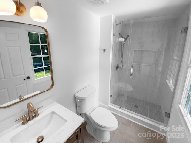 7134 Rollingridge Dr, Charlotte, NC 28211 - bathroom with vanity, toilet, a marble finish shower, tile patterned flooring, and healthy amount of natural light