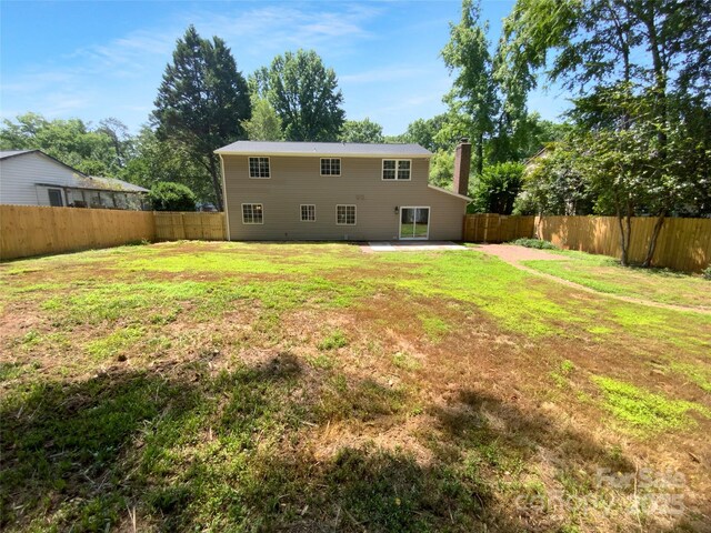 7134 Rollingridge Dr, Charlotte, NC 28211 - back of house with a chimney and a patio