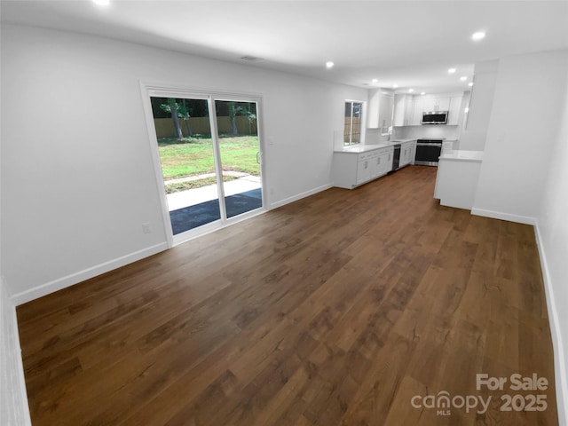 7134 Rollingridge Dr, Charlotte, NC 28211 - unfurnished living room with recessed lighting, baseboards, and dark wood finished floors