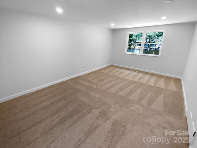 7134 Rollingridge Dr, Charlotte, NC 28211 - carpeted empty room featuring baseboards and recessed lighting