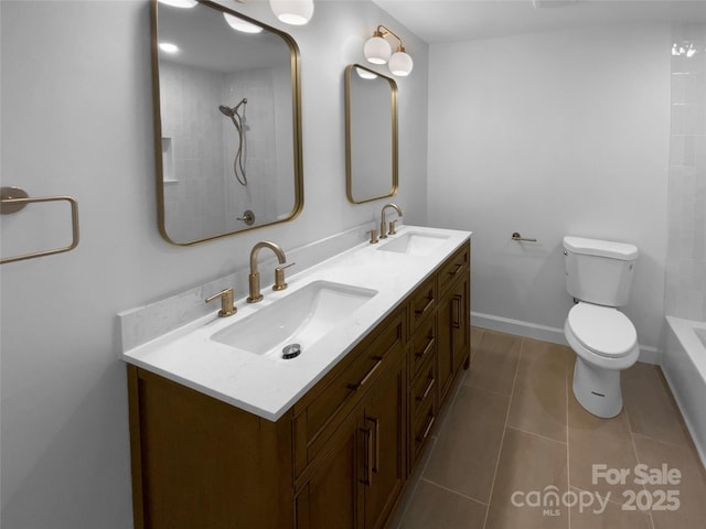7134 Rollingridge Dr, Charlotte, NC 28211 - bathroom featuring double vanity, toilet, and tile patterned floors