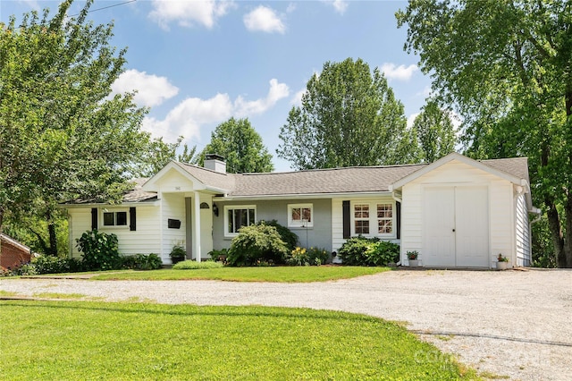 540 Oak Grove Rd, Flat Rock, NC 28731 - ranch-style home with a front yard, gravel driveway, and a chimney