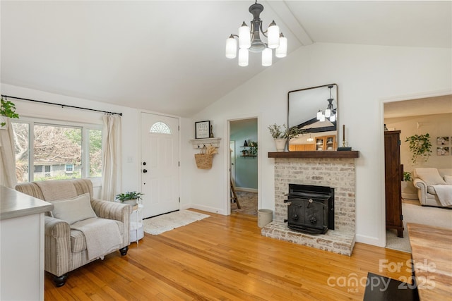 540 Oak Grove Rd, Flat Rock, NC 28731 - living area featuring light wood finished floors, a chandelier, beamed ceiling, and high vaulted ceiling