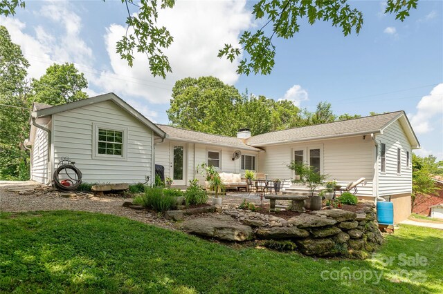 540 Oak Grove Rd, Flat Rock, NC 28731 - back of house with a patio, a yard, a chimney, and an outdoor hangout area