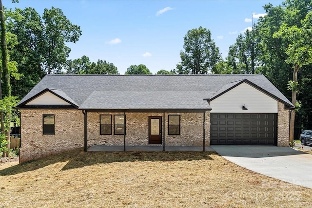 5526 Brookwood Ln, Hickory, NC 28602 - single story home featuring an attached garage, concrete driveway, brick siding, and a shingled roof
