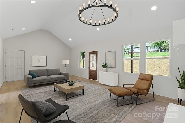 5526 Brookwood Ln, Hickory, NC 28602 - living area with lofted ceiling, wood finished floors, a chandelier, healthy amount of natural light, and recessed lighting