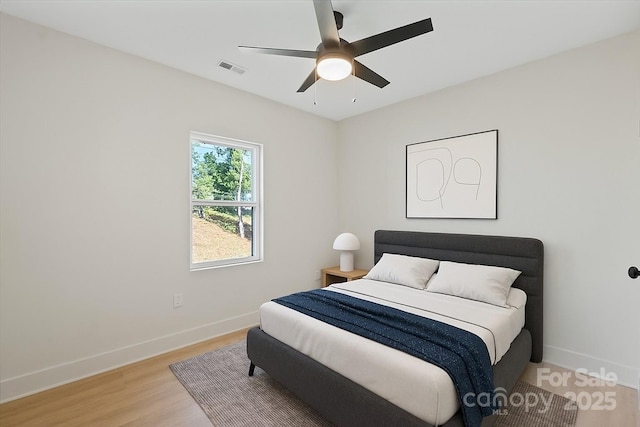 5526 Brookwood Ln, Hickory, NC 28602 - bedroom with light wood-style flooring and ceiling fan