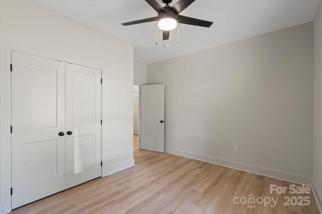 5526 Brookwood Ln, Hickory, NC 28602 - unfurnished bedroom featuring light wood finished floors, a closet, and a ceiling fan