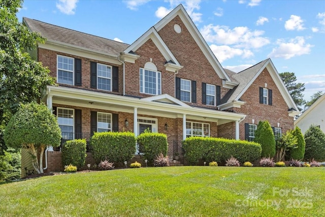 110 Isle Run Dr, Mooresville, NC 28117 - view of front of home with brick siding and a front yard