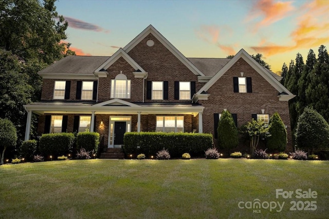 110 Isle Run Dr, Mooresville, NC 28117 - view of front facade with a front yard and brick siding