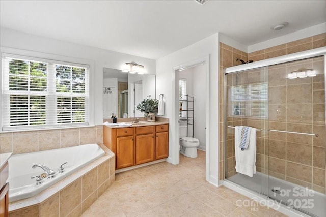 110 Isle Run Dr, Mooresville, NC 28117 - bathroom featuring vanity, a shower stall, a bath, and tile patterned flooring