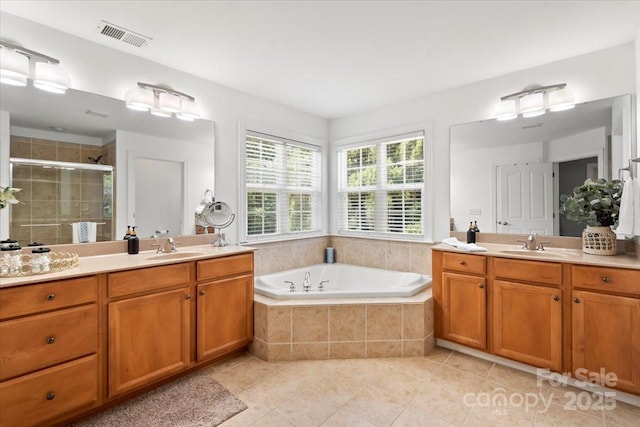 110 Isle Run Dr, Mooresville, NC 28117 - bathroom featuring two vanities, tile patterned flooring, a shower stall, and a bath