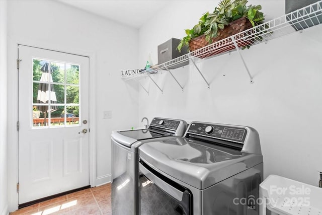 110 Isle Run Dr, Mooresville, NC 28117 - laundry room with independent washer and dryer and light tile patterned floors