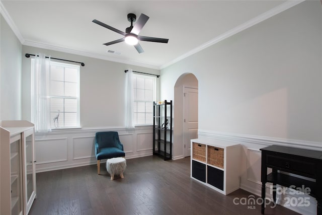 334 Kennerly Center Dr, Mooresville, NC 28115 - sitting room featuring arched walkways, hardwood / wood-style flooring, a ceiling fan, crown molding, and wainscoting