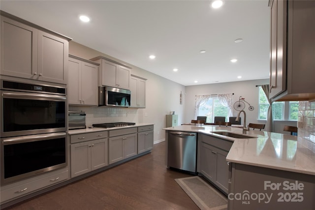 334 Kennerly Center Dr, Mooresville, NC 28115 - kitchen featuring stainless steel appliances, gray cabinets, dark wood-style floors, and recessed lighting