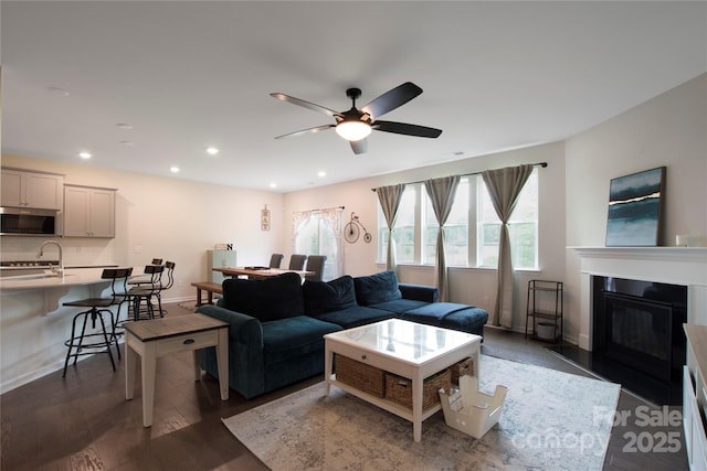 334 Kennerly Center Dr, Mooresville, NC 28115 - living room with ceiling fan, recessed lighting, wood finished floors, and a fireplace with flush hearth