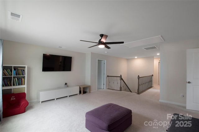 334 Kennerly Center Dr, Mooresville, NC 28115 - living area featuring attic access, an upstairs landing, carpet floors, and ceiling fan