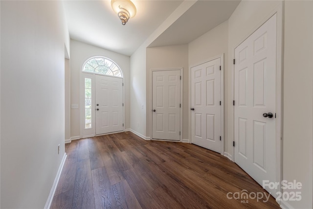 901 Clearbrook Rd, Matthews, NC 28105 - entryway featuring dark wood-style floors and vaulted ceiling