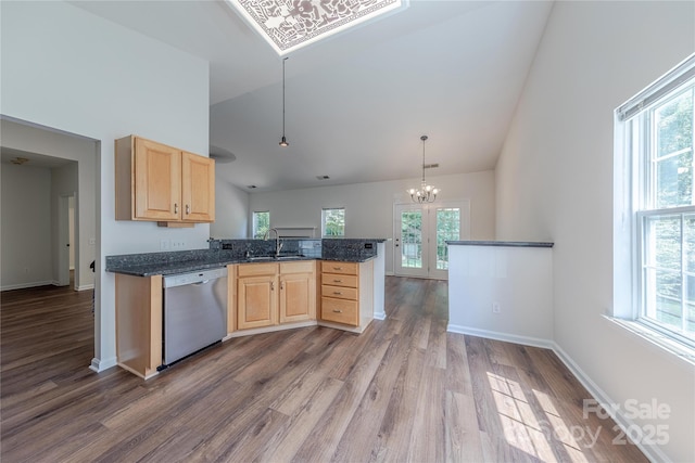 901 Clearbrook Rd, Matthews, NC 28105 - kitchen with light brown cabinetry, high vaulted ceiling, dark wood-type flooring, and stainless steel dishwasher