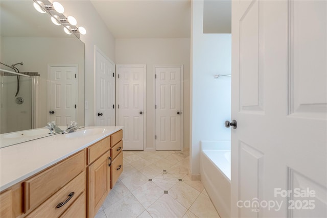 901 Clearbrook Rd, Matthews, NC 28105 - full bath with vanity, a shower stall, a garden tub, and tile patterned flooring