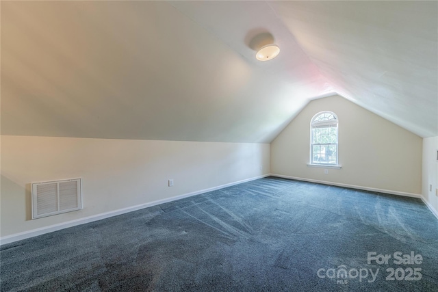 901 Clearbrook Rd, Matthews, NC 28105 - additional living space featuring lofted ceiling and dark carpet