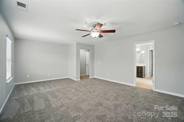 8115 Kelburn Ln, Charlotte, NC 28273 - unfurnished bedroom with carpet flooring, ceiling fan, and connected bathroom