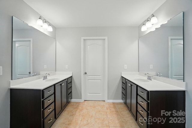 8115 Kelburn Ln, Charlotte, NC 28273 - bathroom with two vanities and baseboards