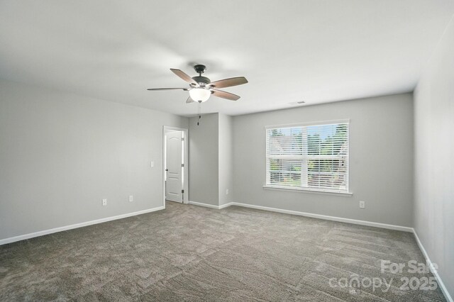8115 Kelburn Ln, Charlotte, NC 28273 - spare room with a ceiling fan and carpet