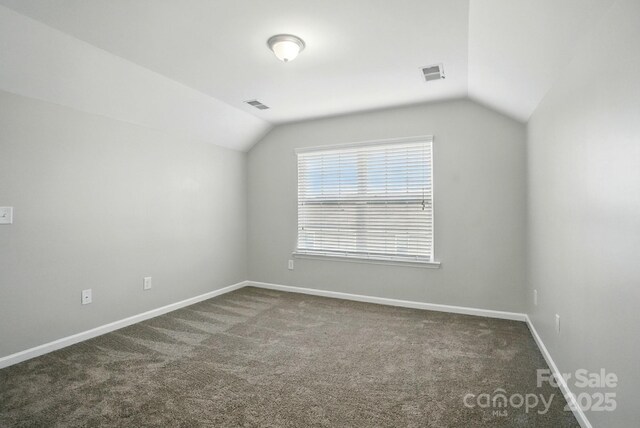 8115 Kelburn Ln, Charlotte, NC 28273 - bonus room featuring vaulted ceiling and dark carpet