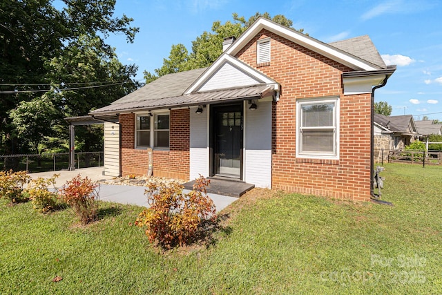 115 E Catawba St, Morganton, NC 28655 - bungalow with brick siding, a chimney, and a shingled roof
