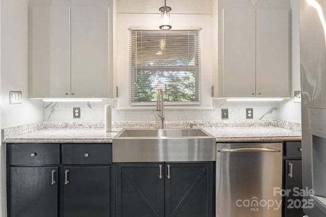 115 E Catawba St, Morganton, NC 28655 - kitchen featuring dishwasher, light stone countertops, pendant lighting, and dark cabinetry