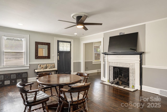 115 E Catawba St, Morganton, NC 28655 - dining area with ceiling fan, a brick fireplace, crown molding, and wood finished floors